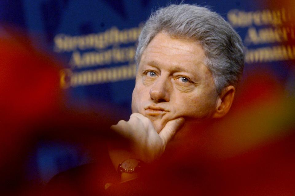 Clinton waits to speak on homelessness in Baltimore in December 1998.