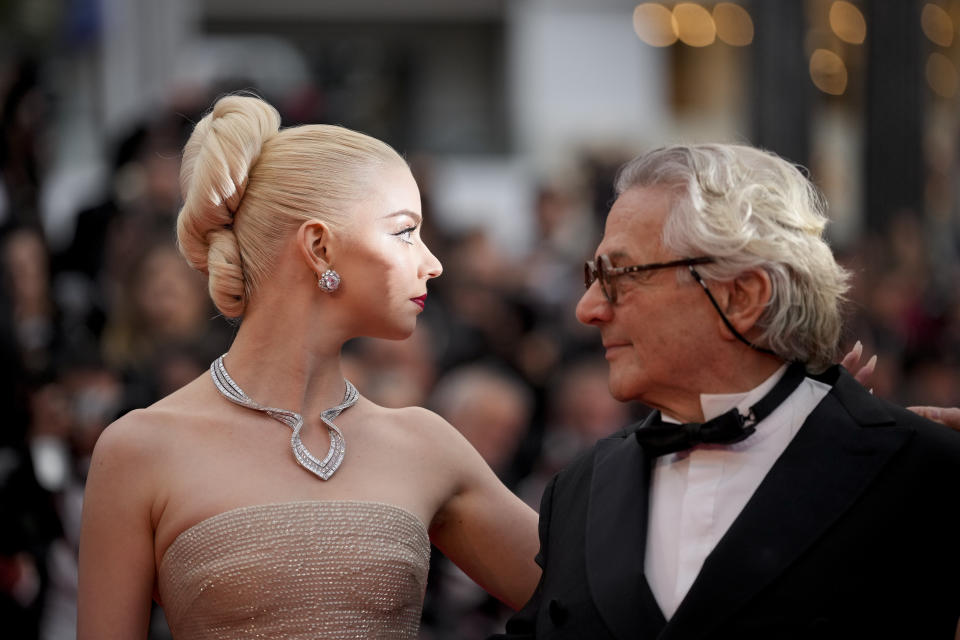 Anya Taylor-Joy, left, and director George Miller pose for photographers upon arrival at the premiere of the film 'Furiosa: A Mad Max Saga' at the 77th international film festival, Cannes, southern France, Wednesday, May 15, 2024. (Photo by Andreea Alexandru/Invision/AP)