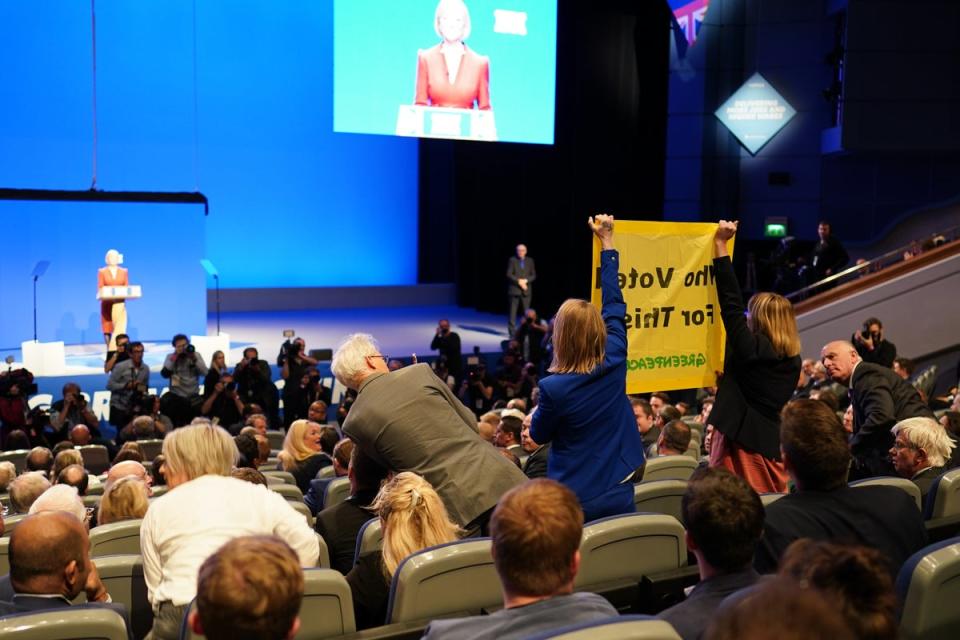 A protester interrupts Prime Minister Liz Truss’s keynote speech on the final day of the Conservative Party Conference (Getty Images)