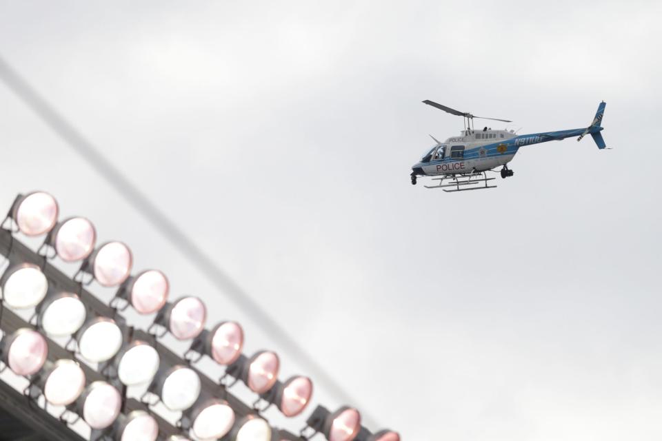 A Chicago Police helicopter field above the city where police were searching for a gunman who opened fire on a group of people, shooting five and injuring one on the city's Northwest Side on June 17, 2024.