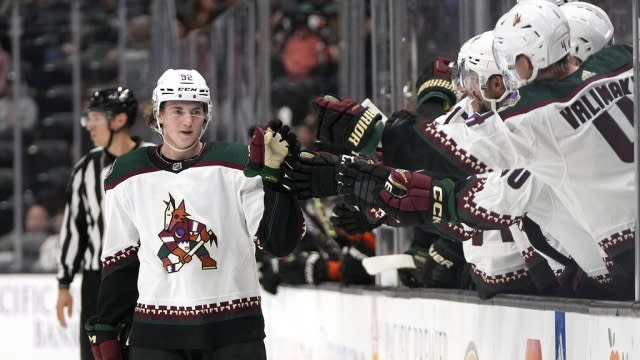 Arizona Coyotes center Logan Cooley is congratulated by teammates.