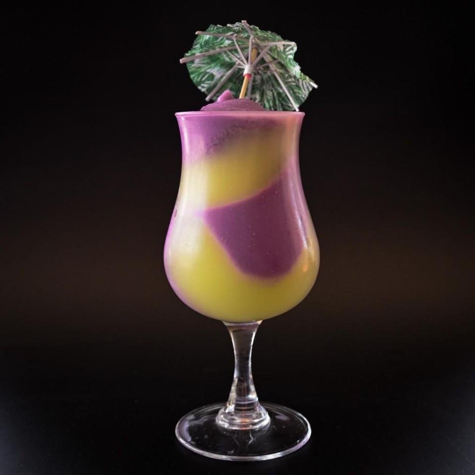 The Golden Pineapple’s summer slushee collection includes the “Space Age Miami Vice,” a melon green apple martini mixed with ube coconut colada.