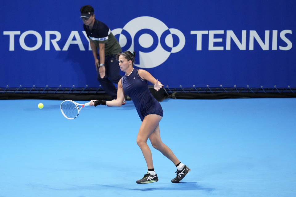 Isabella Shinikova of Bulgaria returns a shot against Karolina Pliskova of the Czech Republic during a singles match in the Pan Pacific Open tennis tournament in Tokyo, Tuesday, Sept. 20, 2022. (AP Photo/Hiro Komae)