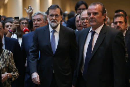 Spain's Prime Minister Mariano Rajoy (C) arrives to take part in a debate at the upper house Senate in Madrid, Spain, October 27, 2017. REUTERS/Susana Vera