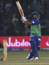 Multan Sultans batsman Zeeshan Ashraf follows the ball after playing a shot during the Pakistan Super League T20 cricket match against Islamabad United at Gaddafi stadium in Lahore, Pakistan, Saturday, Feb. 22, 2020. (AP Photo/K.M. Chaudary)