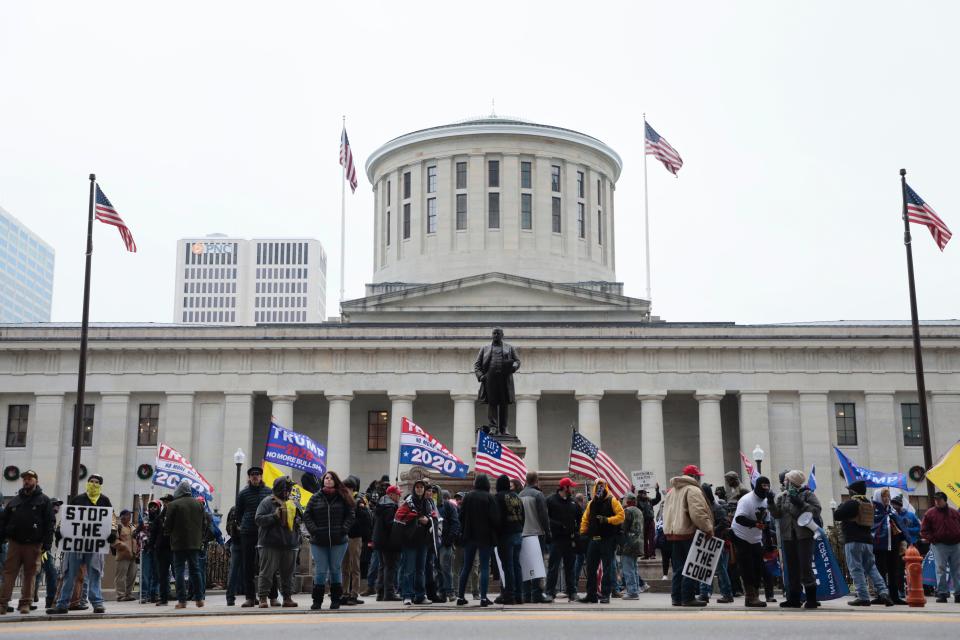 Protestors gather in front of the Ohio Statehouse during a rally of several different groups responding to 2020 election results in Downtown Columbus, Ohio on January 6, 2021. Protestors came out to the Statehouse grounds in solidarity with a gathering in Washington who hope to overturn the 2020 election results which confirm Joe Biden as President Elect. 