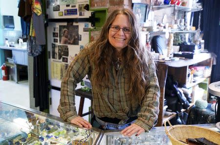 Kathleen Chippi poses in her shop in Nederland, Colorado March 14, 2015. REUTERS/Rick Wilking