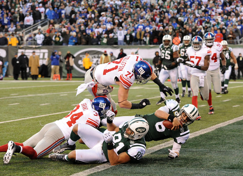 Mark Sanchez #6 of the New York Jets scores a touchdown during the second half against the New York Giants on December 24, 2011 at MetLife Stadium in East Rutherford, New Jersey. (Photo by Christopher Pasatieri/Getty Images)