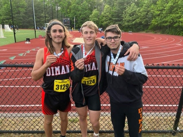 Diman track athletes show off their medals after Thursday's Division IV meet at Notre Dame in Hingham