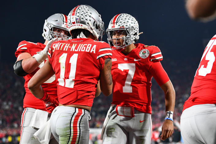 Ohio State Buckeyes quarterback C.J. Stroud (7) celebrates with Jaxon Smith-Njigba (11) after a touchdown during the Rose Bowl on Jan. 1. (Brian Rothmuller/Getty Images)