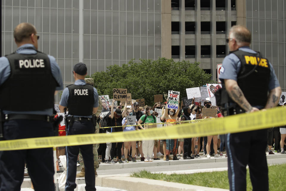 Demonstrators gather at police headquarters in downtown Kansas City, Missouri, to protest the death of George Floyd.