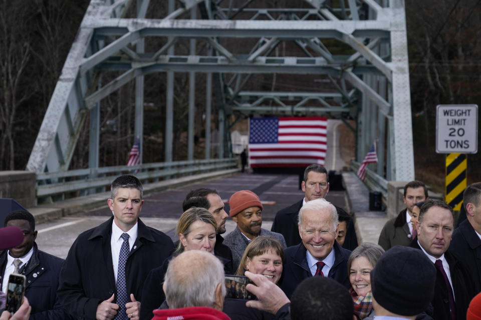 President Joe Biden greets people after speaking during a visit to the NH 175 bridge over the Pemigewasset River to promote infrastructure spending Tuesday, Nov. 16, 2021, in Woodstock, N.H. (AP Photo/Evan Vucci)