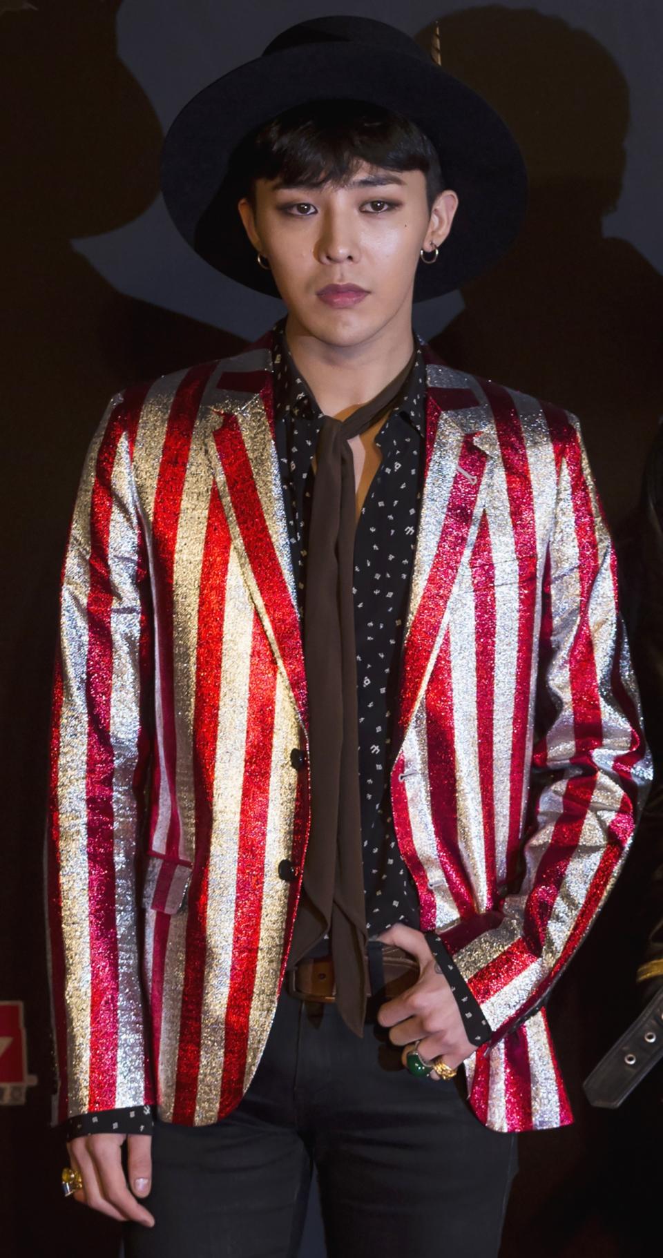 South Korean artist Kwon Ji-yong, stage name G-Dragon, a member of K-Pop idol group Big Bang, poses on the red carpet as he attends the 2014 Mnet Asian Music Awards (MAMA) in Hong Kong