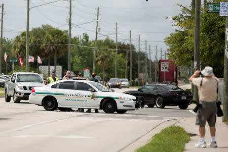 Investigators work the scene of a fatal workplace shooting in Orlando, Florida, June 5, 2017. REUTERS/Daniel LeClair