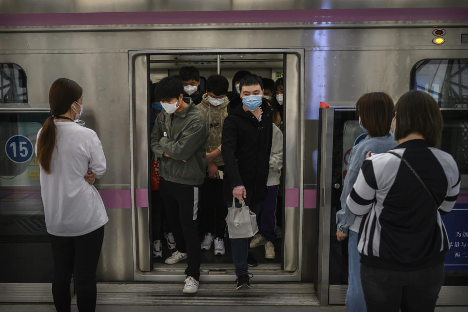 BEIJING, CHINA - APRIL 15: Chinese commuters wear protective masks as they exit the subway during rush hour on April 15, 2020 in Beijing, China. China lifted its lockdown on Wuhan, the first epicentre of COVID-19 after 76 days last week, allowing healthy people to leave. With the pandemic hitting hard across the world, officially the number of coronavirus cases in China is dwindling, ever since the government imposed sweeping measures to keep the disease from spreading.  For more than two months, millions of people across China have been restricted in how they move from their homes, while other cities have been locked down in ways that appeared severe at the time but are now being replicated in other countries trying to contain the virus. Officials believe the worst appears to be over in China, though there are concerns of another wave of infections as the government attempts to reboot the worlds second largest economy. Since January, China has recorded more than 81,000 cases of COVID-19 and at least 3200 deaths, mostly in and around the city of Wuhan, in central Hubei province, where the outbreak first started. (Photo by Kevin Frayer/Getty Images)