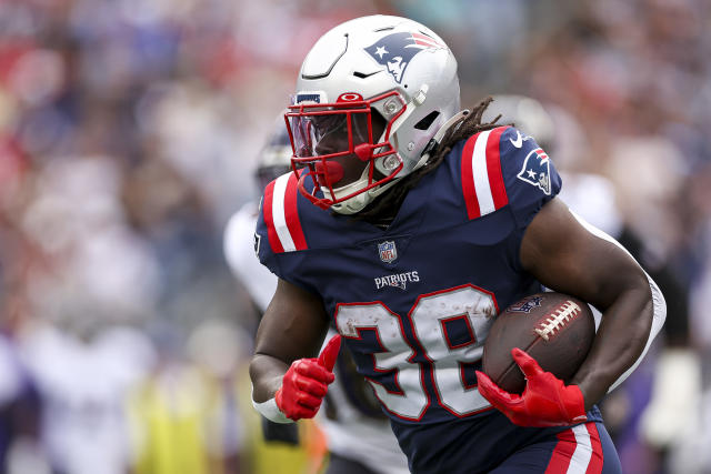 Rhamondre Stevenson New England Patriots Unsigned Makes a 30-Yard Touchdown  Photograph