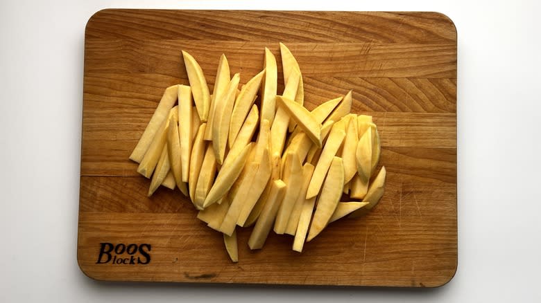 sliced rutabaga on wooden board