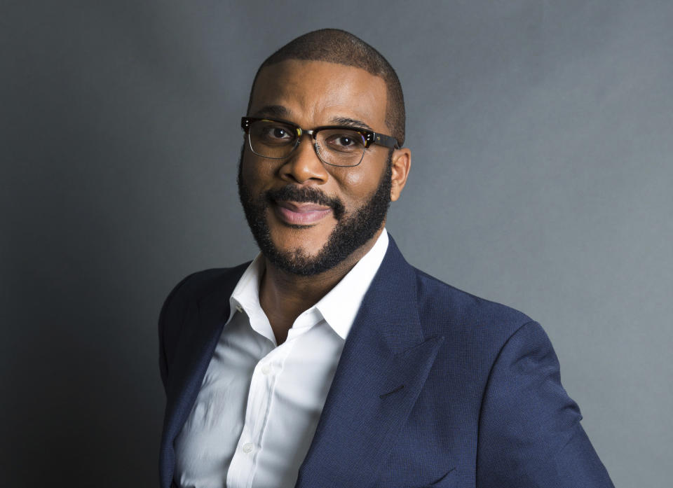 FILE - In this Nov. 16, 2017, file photo, actor-filmmaker and author Tyler Perry poses for a portrait in New York. Perry is looking to reopen his 330-acre Atlanta-based mega studio soon, but other studios in Georgia are anxiously waiting for Hollywood's green light to return back to work. Perry plans on restarting production at the Tyler Perry Studios complex in July, making it one of the first studios to domestically reopen after production was halted a few months ago to combat the spread of the coronavirus. (Photo by Amy Sussman/Invision/AP, File)