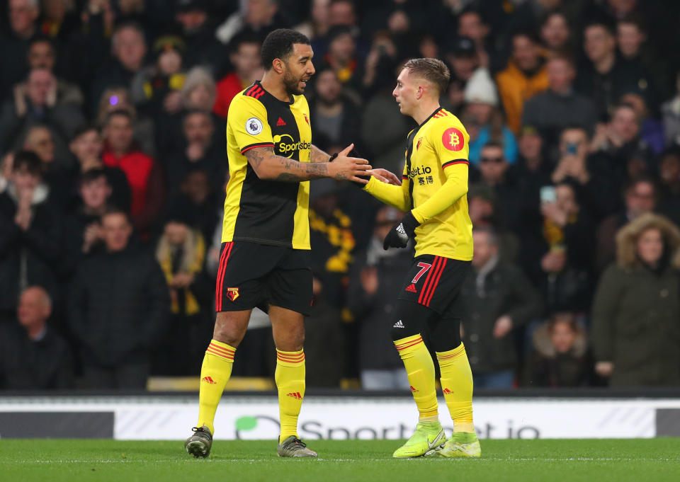 WATFORD, ENGLAND - JANUARY 01: Gerard Deulofeu of Watford celebrates after scoring his sides first goal with teammate Troy Deeney of Watford during the Premier League match between Watford FC and Wolverhampton Wanderers at Vicarage Road on January 01, 2020 in Watford, United Kingdom. (Photo by Catherine Ivill/Getty Images)