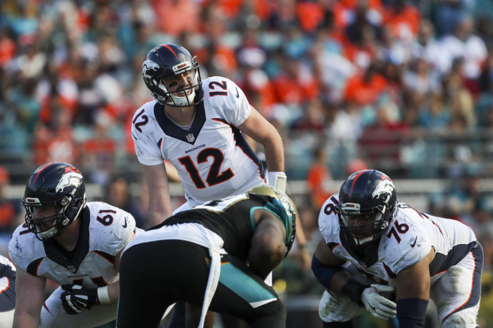 Dec 4, 2016; Jacksonville, FL, USA;  Denver Broncos quarterback Paxton Lynch (12) looks on prior to a play against the Jacksonville Jaguars in the second quarter at EverBank Field. The Denver Broncos won 20-10. Mandatory Credit: Logan Bowles-USA TODAY Sports