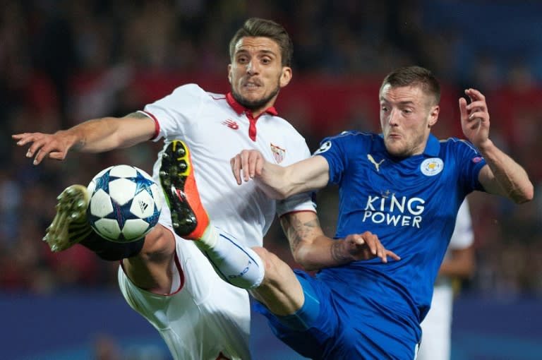 Sevilla's Daniel Carrico (L) vies with Leicester City's Jamie Vardy during their Champions League round of 16 second leg in Sevilla, southern Spain on February 22, 2017