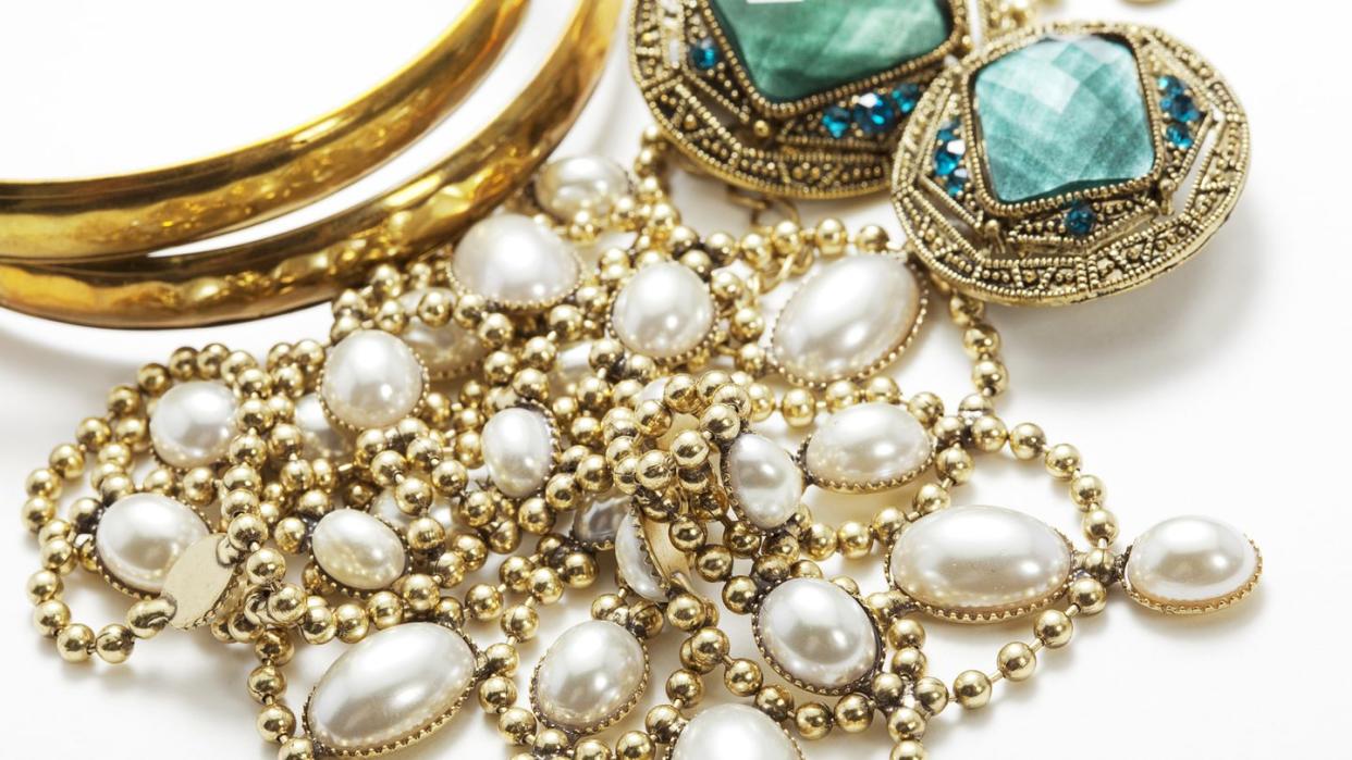 collection of vintage jewelry on white surface