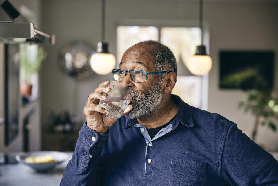 Healthier habits, like replacing sugary drinks with hydrating water, can help you live better. (Getty Images)