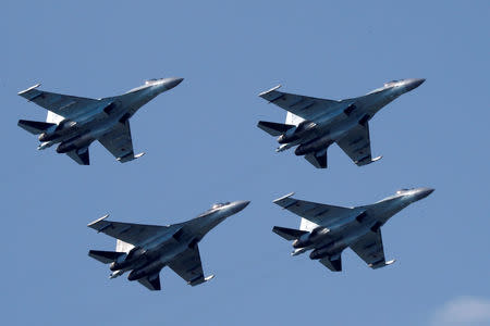 FILE PHOTO: Sukhoi Su-35 multi-role fighters of the Sokoly Rossii (Falcons of Russia) aerobatic team fly in formation during a demonstration flight at the MAKS 2017 air show in Zhukovsky, outside Moscow, Russia, July 21, 2017. REUTERS/Sergei Karpukhin/File Photo