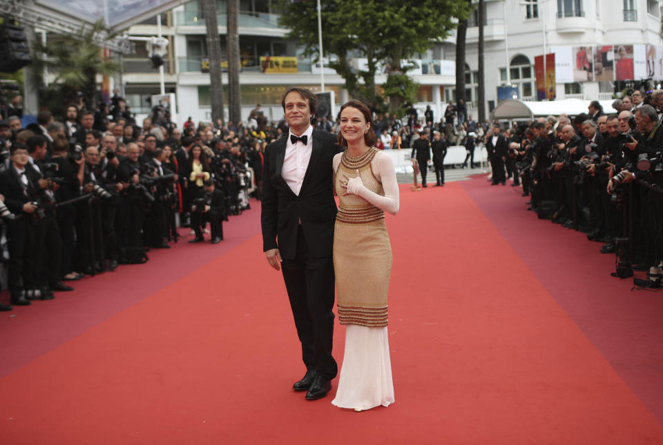 Actors August Diehl, left, and Valerie Pachner pose for photographers upon arrival at the premiere of the film 'A Hidden Life' at the 72nd international film festival, Cannes, southern France, Sunday, May 19, 2019. (AP Photo/Petros Giannakouris)