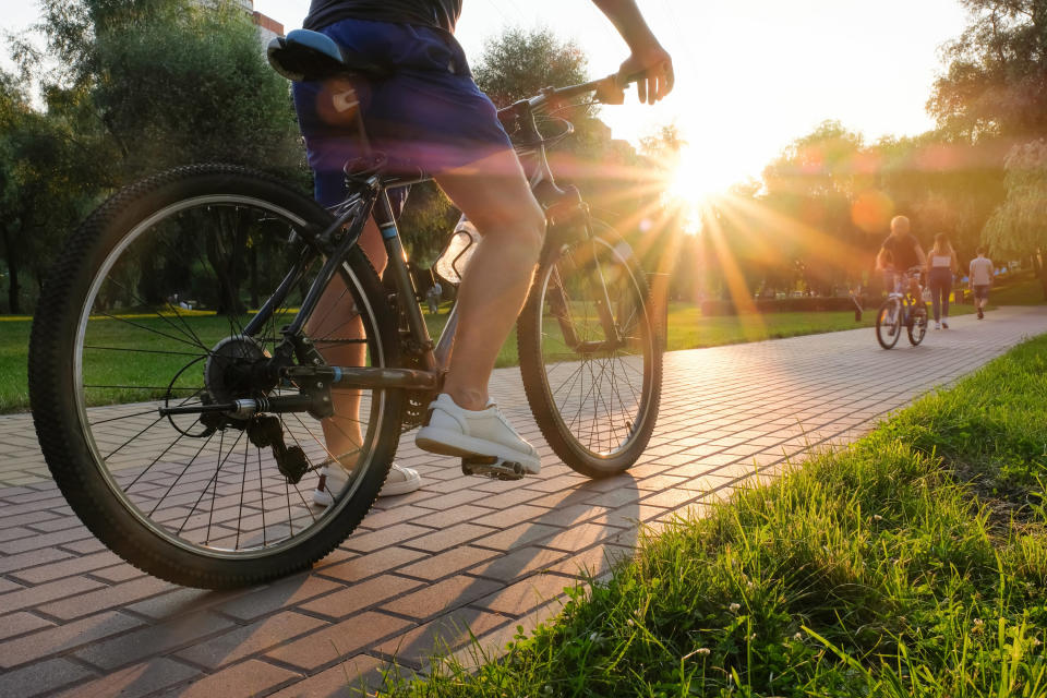 a person on a bike on pavers