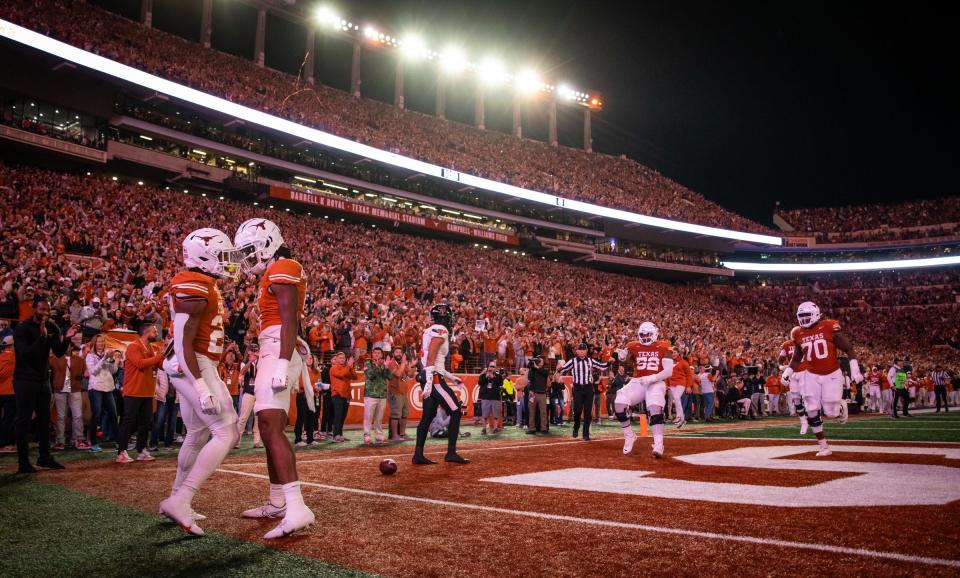 Texas running back Jaydon Blue, left, celebrates his 69-yard touchdown with wide receiver Adonai Mitchell during the second quarter of Texas' 57-7 win over Texas Tech on Nov. 24. The Longhorns are 12-1 heading into their College Football Playoff matchup with Washington in the Sugar Bowl.