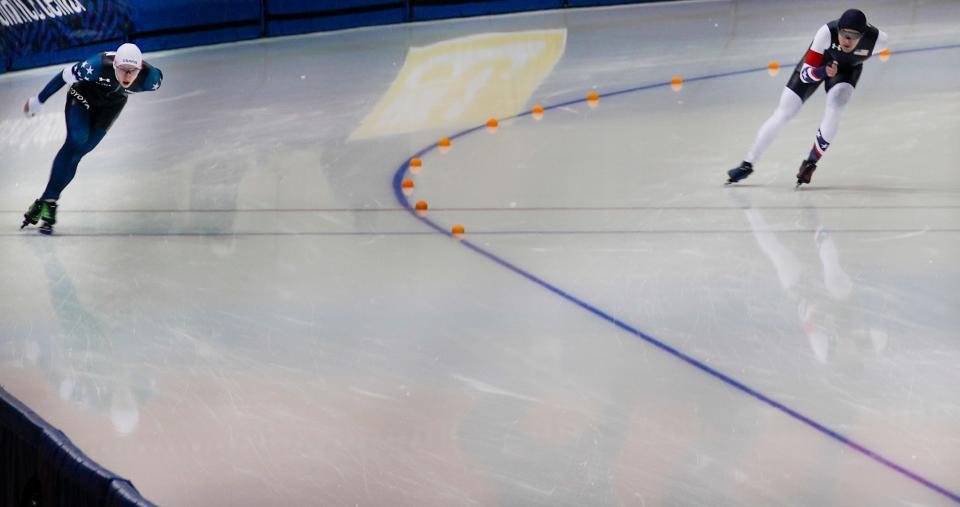 Jordan Stolz, left, and Casey Dawson compete during the 5,000-meter event at Pettit National Ice Center on Thursday.