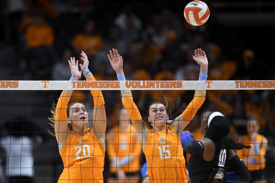 Tennessee middle blocker Ava Bell (20) and outside hitter Lily Felts (15) defends against Kentucky opposite hitter Reagan Rutherford (10) in an NCAA volleyball match between the Tennessee Lady Vols and Kentucky Wildcats in Knoxville, Tenn. on Wednesday, October 27, 2021.