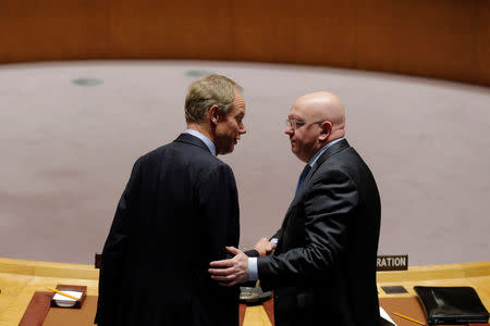 Russian Ambassador to the United Nations (UN) Vasily Nebenzya (R) speaks with British Ambassador to the UN, Matthew Rycroft, before a meeting of the UN Security Council to discuss a North Korean missile launch at UN headquarters in New York, U.S., November 29, 2017. REUTERS/Lucas Jackson