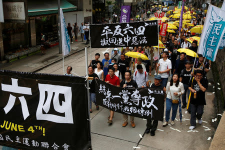 Protesters take part in a march ahead of June 4 anniversary of military crackdown on pro-democracy protesters in Tiananmen Square, in Hong Kong, China May 26, 2019. REUTERS/James Pomfret