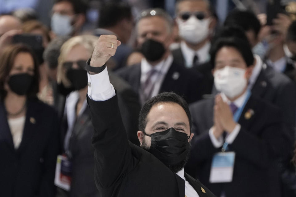 Honduras' Congressional President Luis Redondo raises his fist during the inauguration of President Xiomara Castro, the country's first female president, at the National stadium in Tegucigalpa, Honduras, Thursday, Jan. 27, 2022. (AP Photo/Moises Castillo)