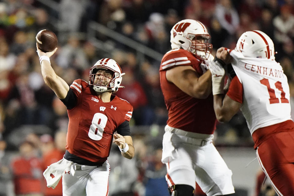 Wisconsin's Tanner Mordecai throws during the first half of an NCAA college football game against Nebraska Saturday, Nov. 18, 2023 in Madison, Wis. (AP Photo/Aaron Gash)