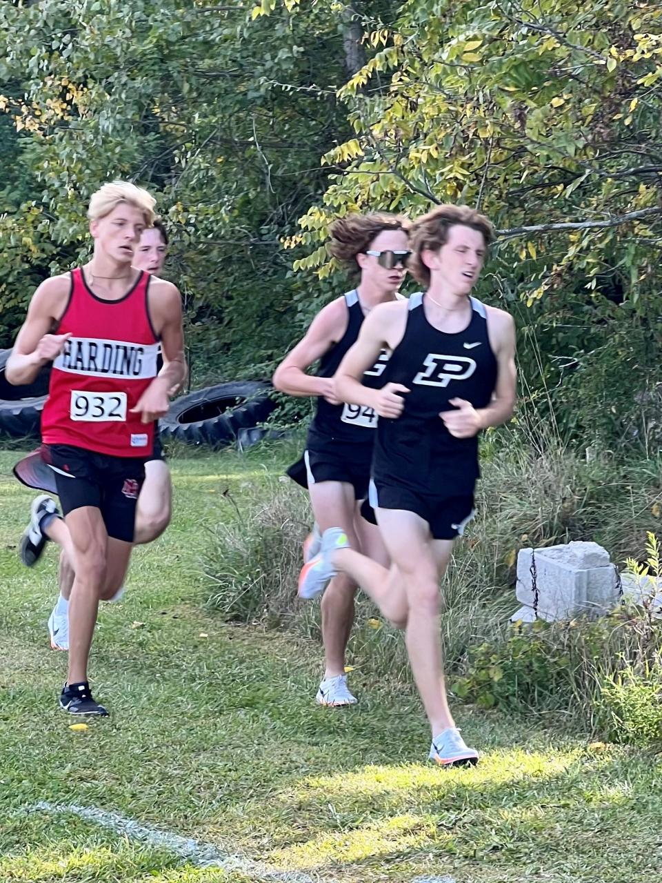 Marion Harding's Kade Sutherland, left, and Pleasant's Will Lichtenberger, right, compete at the Ridgedale Rocket Cross Country Run last week.