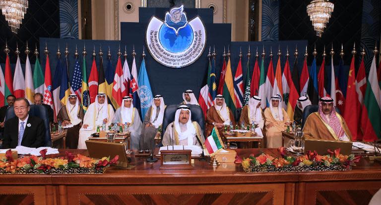 Emir of Kuwait Sheikh Sabah al-Ahmad al-Sabah (C), United Nations Secretary General Ban Ki-moon (L) and Kuwaiti Foreign Minister Sheikh Sabah al-Khaled al-Sabah attend a donor conference for Syria in Kuwait City, on March 31, 2015