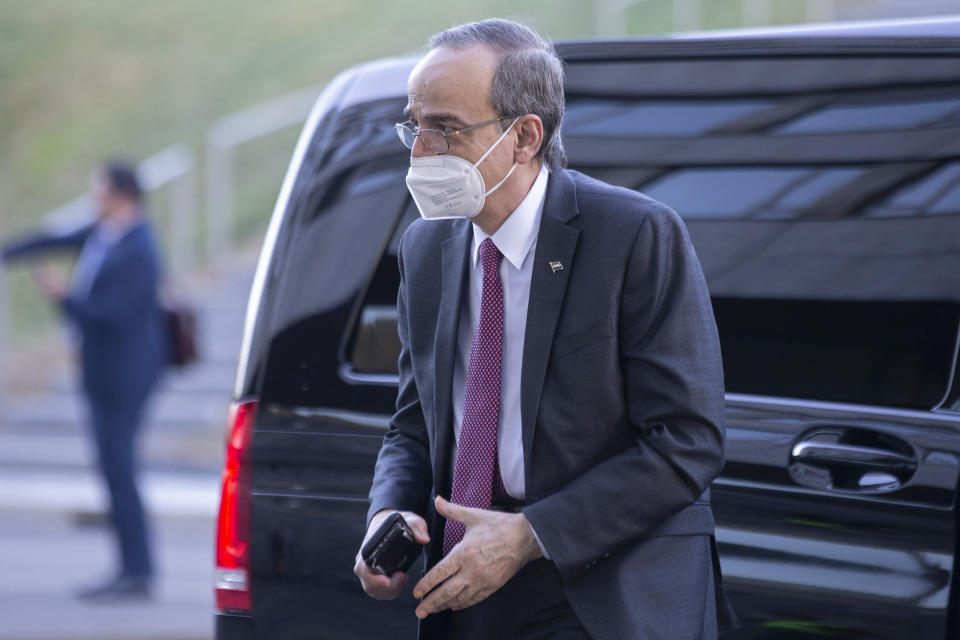 The Syrian Constitutional Committee Co-Chair Hadi al-Bahra from the opposition, wearing face mask as precaution against the spread of the coronavirus COVID-19, arrives for opening the sixth session of the Constitutional Committee, at the European headquarters of the United Nations in Geneva, Switzerland, Monday, October 18, 2021. (Salvatore Di Nolfi/Keystone via AP)