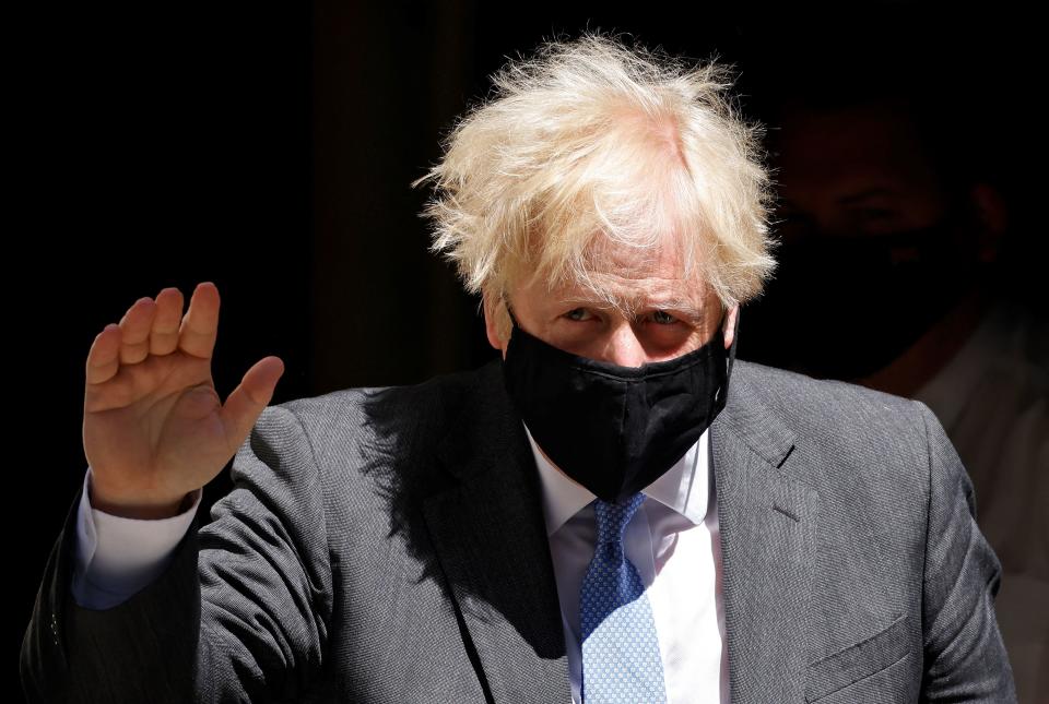 Britain's Prime Minister Boris Johnson, wearing a face mask to combat the spread of Covid-19, leaves 10 Downing Street in central London on June 16, 2021, to take part in the weekly session of Prime Minister's Questions (PMQs) at the House of Commons. (Photo by Tolga Akmen / AFP) (Photo by TOLGA AKMEN/AFP via Getty Images)