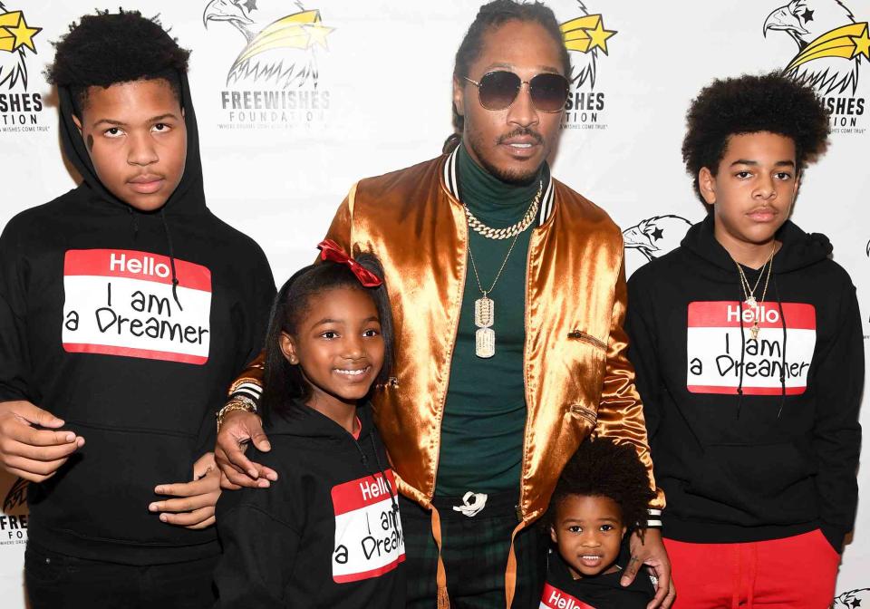 <p>Paras Griffin/Getty</p> Future poses with his children at 5th Annual FreeWishes Foundation A Winter Wishland on December 17, 2017 in Atlanta, Georgia.