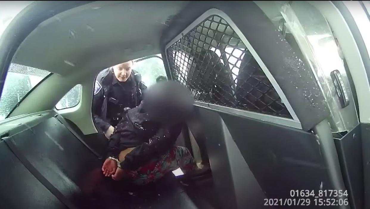 The 9-year-old girl was handcuffed and placed in the backseat of a police car. When she apparently refused to put her feet inside the vehicle, the video shows she was pepper-sprayed. (Photo: Rochester Police Department)