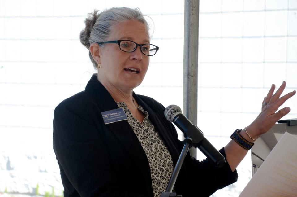 Gail Kloss, executive director of the Women’s Resource Center of Northern Michigan, speaks about the Empowering Bright Futures initiative on Tuesday, May 14, 2024 during the group's groundbreaking ceremony.