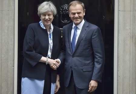Britain's Prime Minister, Theresa May, greets Donald Tusk, the President of the European Council, outside 10 Downing Street, in central London, Britain April 6, 2017. REUTERS/Hannah McKay