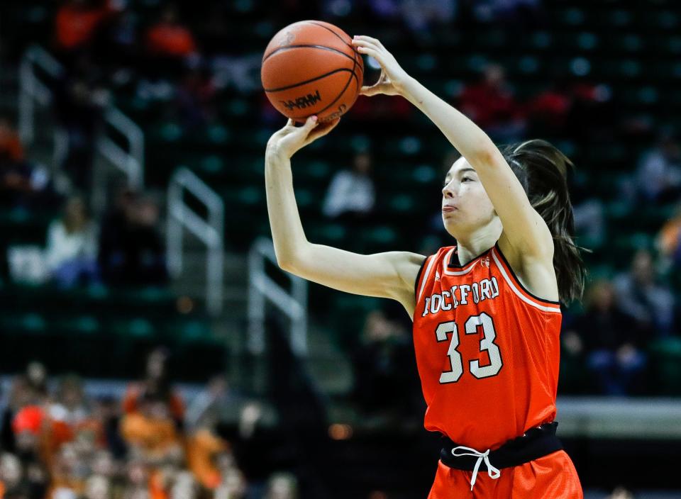 Rockford guard Sienna Wolfe (33) makes a jump shot against West Bloomfield  during the first half of the MHSAA Division 1 girls basketball final at Breslin Center in East Lansing on Saturday, March 18, 2023.