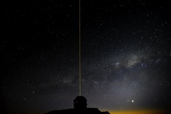 The Gemini South telescope in Chile is seen, laser blazing, during laser operations using the Gemini Multi-conjugate adaptive optics System (GeMS). The laser-guided advanced optics system cancels out atmospheric turbulence caused by Earth's atm