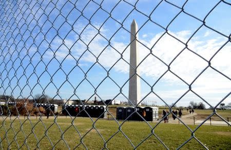 Chain link fencing is up around the Washington Monument as a security measure in the days prior to Donald J. Trump's inauguration, in Washington, U.S., January 15, 2017. REUTERS/Mike Theiler