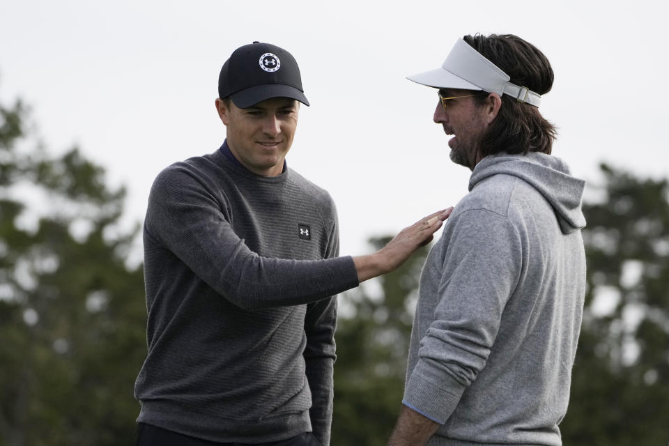 Jordan Spieth, left, greets playing partner Jake Owen on the first green of the Spyglass Hill Golf Course during the AT&T Pebble Beach Pro-Am golf tournament in Pebble Beach, Calif., Thursday, Feb. 2, 2023. (AP Photo/Godofredo A. Vásquez)