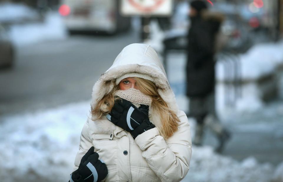 A commuter makes a sub-zero trek through Chicago on Jan. 6, 2014. That cold snap was due in part to the polar vortex.